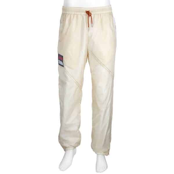 Heron Preston Men's Bottoms. Fashion category: Pants & Leggings. SKU: HMCA016F19616032-0288. Color: White. Heron Preston Men's Panelled Parachute Track Pants. This cotton-blend track pants features an elasticated drawstring waist, stitching details, zipped side pockets, a logo tag, a back pocket and zipped cuffs. Materials: 100% Polyamide, 50% Cotton, 50% Polyester. Made in Italy.